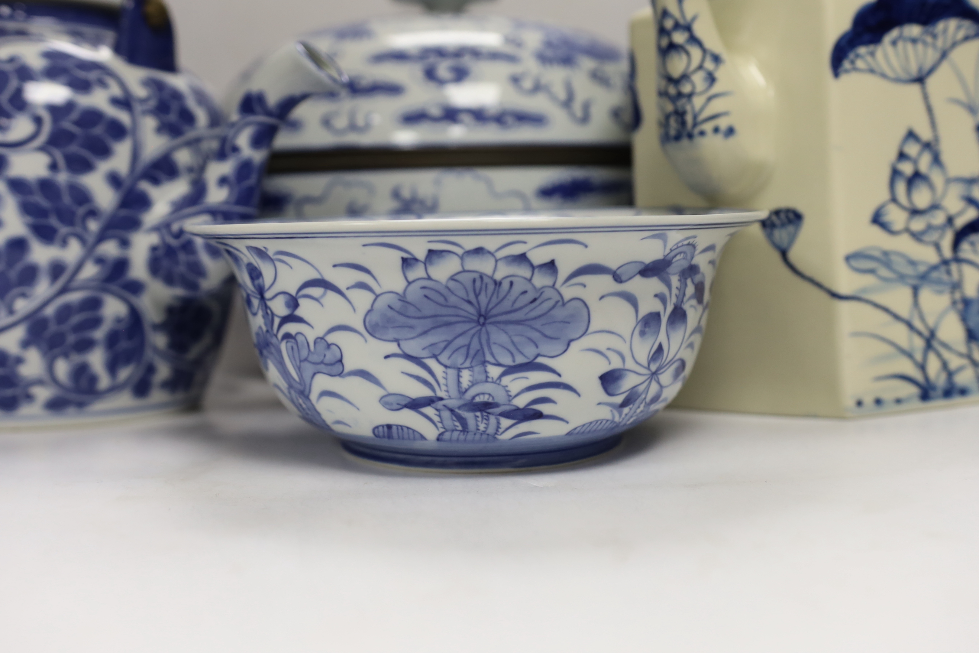 Four modern Chinese blue and white ceramic items; two teapots, a lidded vessel and a bowl, tallest 23.5cm